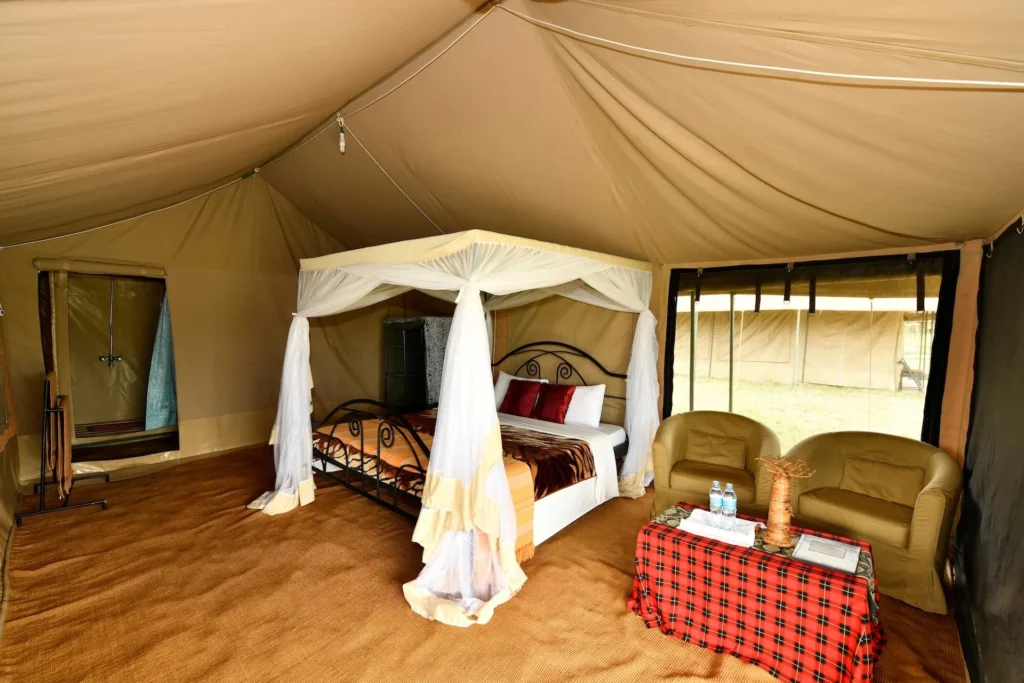 Interior view of a luxury tented room at the best migration camps Serengeti features.