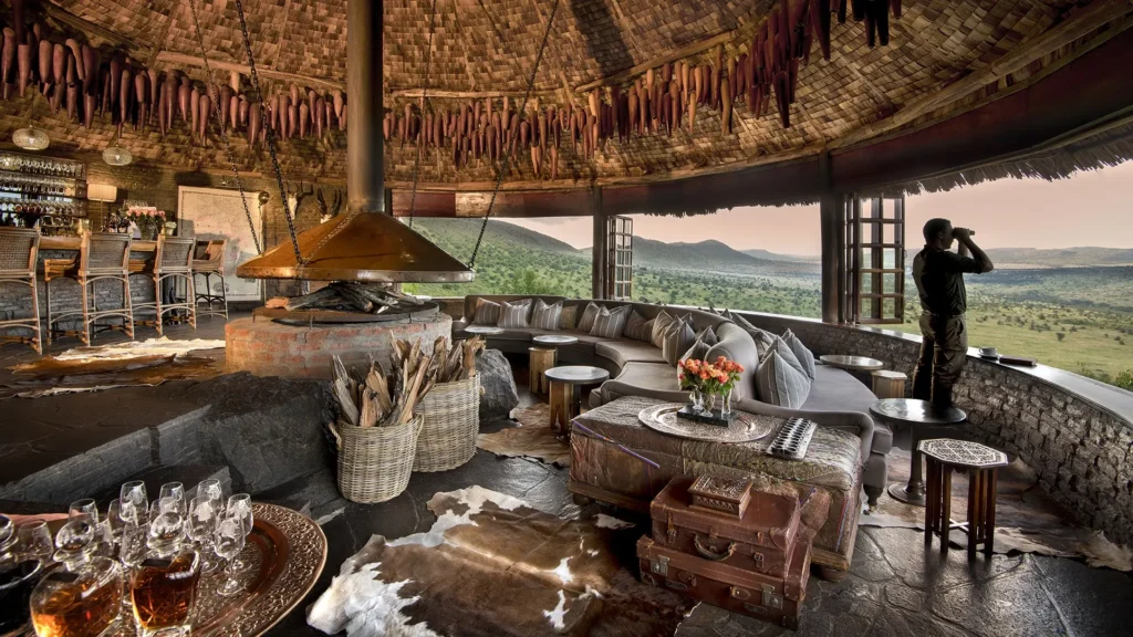 Luxury lounge at andBeyond Crater Lodge, paired with the best migration camps Serengeti packages.